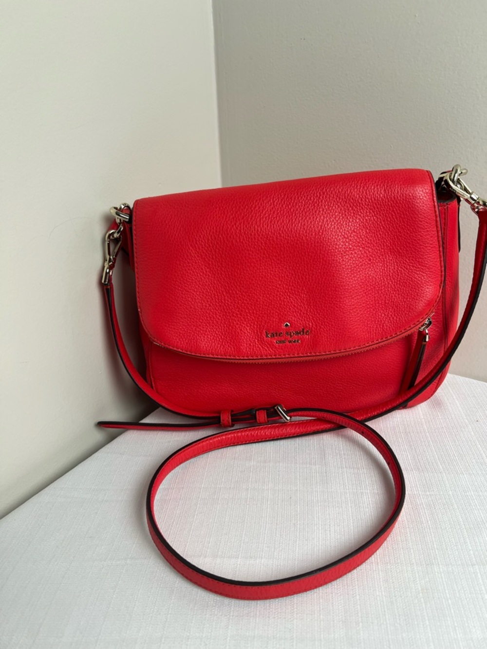 kate spade Jackson Pebbled Leather Flap Crossbody with Gold Hardware in Coral